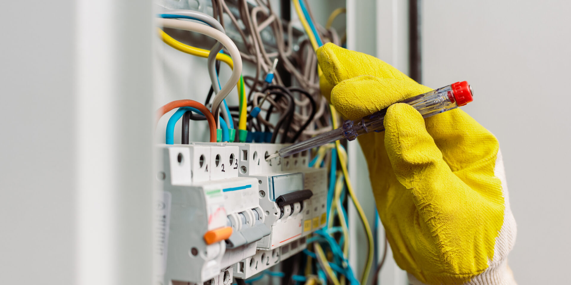 Electrician inspecting wiring
